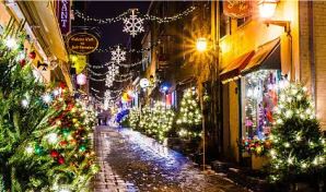 Quebec City, Canada.  Quaint street with houses and businesses decorated for the holidays.