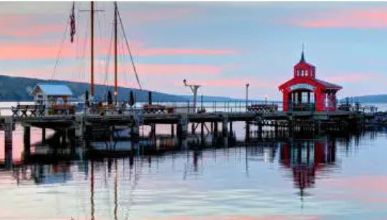 Finger Lakes, Seneca Lake.  A huge shipping dock on the lake surrounded by hills and beautiful sky.